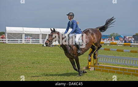 Stithians, UK. 15th July, 2013. Horse clears the fence during the show jumping contest at the Stithians show, Cornwall's biggest one day show. Credit:  Bob Sharples/Alamy Live News Stock Photo