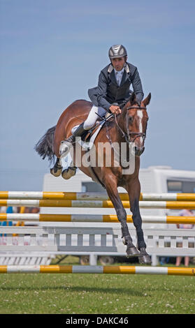 Stithians, UK. 15th July, 2013. Horse clears the fence during the show jumping contest at the Stithians show, Cornwall's biggest one day show. Credit:  Bob Sharples/Alamy Live News Stock Photo