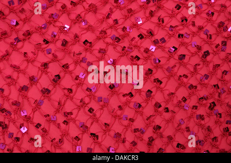 Net with Square Sequins above the cloth background Stock Photo