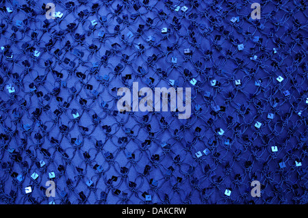 Net with Square Sequins above the cloth background Stock Photo