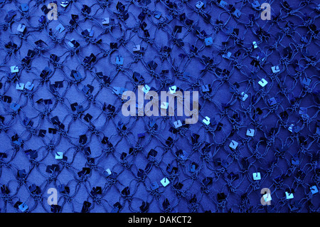 Net with Square Sequins above the cloth background Stock Photo