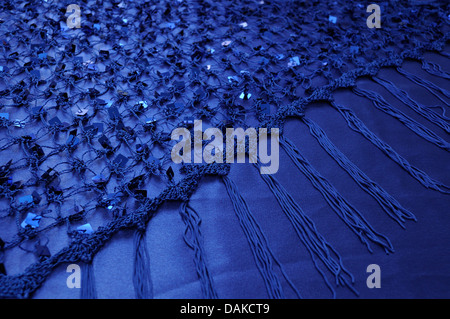 Net with Square Sequins above the cloth background Stock Photo