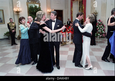 Diana, Princess of Wales dances with President Ronald Reagan as First Lady Nancy Reagan dances with Prince Charles during a White House Gala Dinner November 9, 1985 in Washington, DC. Stock Photo