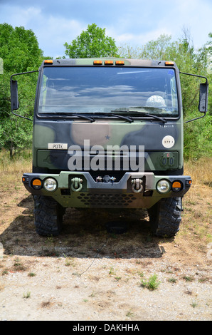 Military personnel carrier, 2 1/2 ton truck in camouflage. Stock Photo