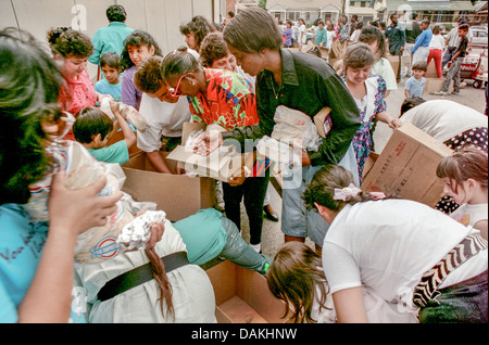 Hungry Hispanic and African American local LA residents fight over free charity food after the 1992 Rodney King race riots. Stock Photo