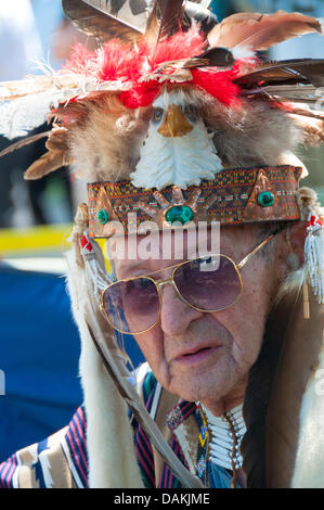 The proud Mohawk nation living in Kahnawake native community located on the south shore of the St Lawrence river in Quebec Canada celebrates it's annual Pow-Wow with traditional dances and drum music -July13-14 2013 Stock Photo