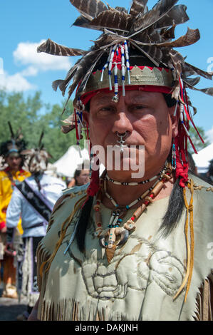 The proud Mohawk nation living in Kahnawake native community located on the south shore of the St Lawrence river in Quebec Canada celebrates it's annual Pow-Wow with traditional dances and drum music Stock Photo