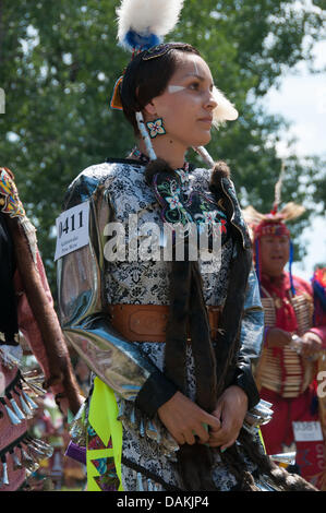 The proud Mohawk nation living in Kahnawake native community located on the south shore of the St Lawrence river in Quebec Canada celebrates it's annual Pow-Wow with traditional dances and drum music -July13-14 2013 Stock Photo