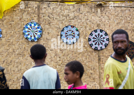 Locals playing darts at the Goroka festival in Papua New Guinea Stock Photo