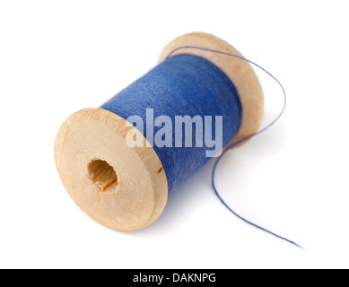 Wooden spool of blue thread isolated on white Stock Photo