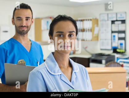 Nurses standing in hospital hallway Stock Photo