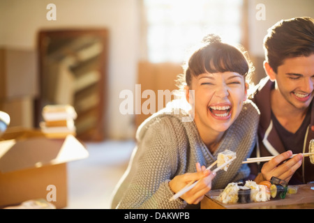 Couple eating sushi together Stock Photo