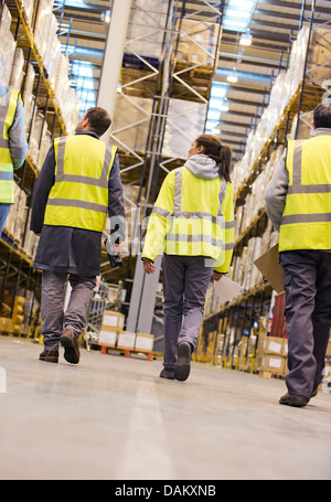 Workers walking in warehouse Stock Photo