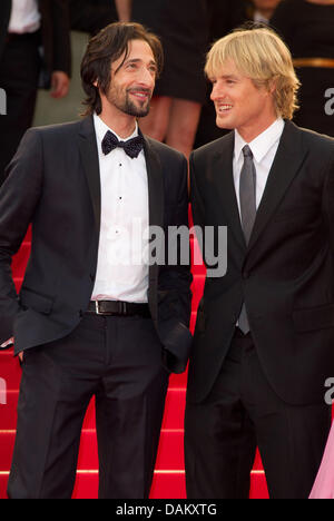 Actors Owen Wilson and Adrien Brody (l) arrive at Palais des Festivals during the Opening of the 64th International Film Festival in Cannes, France, on 11 May 2011. Photo: Hubert Boesl Stock Photo