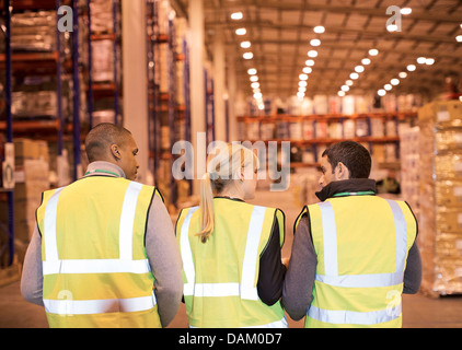 Workers talking in warehouse Stock Photo