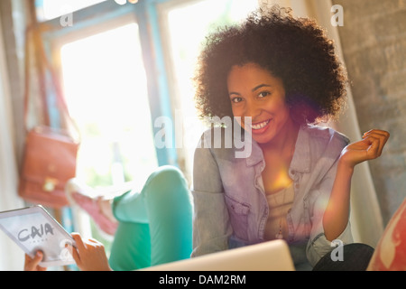 Woman smiling in bedroom Stock Photo