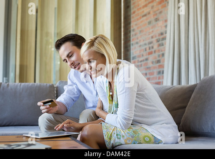 Couple shopping online with tablet computer Stock Photo