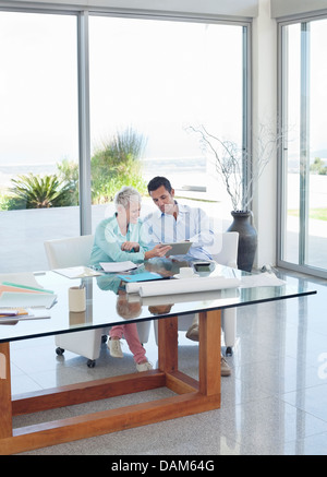 Business people talking at desk Stock Photo