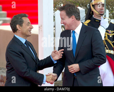 French President Nicolas Sarkozy (L) and British Prime Minister David Cameron greet each other before the G8 Summit in Deauville, France, 26 May 2011. This year's G8 Summit is taking place in the French resort on the English Channel on 26 and 27 May 2011. Photo: PEER GRIMM Stock Photo
