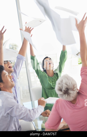 Business people cheering in office Stock Photo