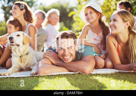Family relaxing in backyard Stock Photo
