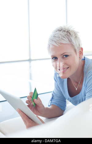 Woman shopping online with tablet computer Stock Photo