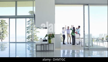 Business people cheering in office Stock Photo