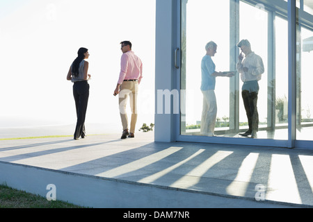 Business people talking outside office Stock Photo