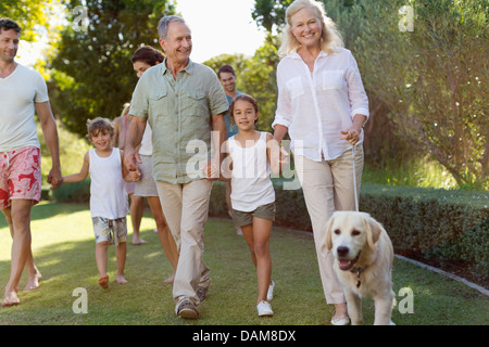 Family walking together in park Stock Photo