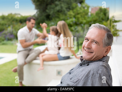 Older man smiling outdoors Stock Photo
