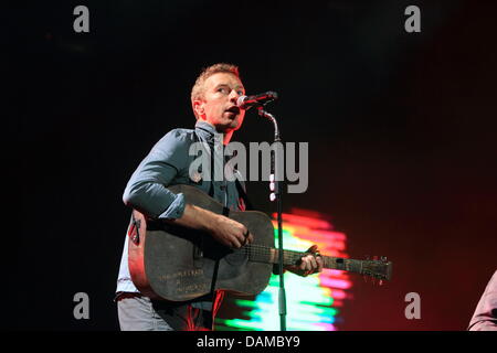 Chris Martin, frontman of the British rock band 'Coldplay' performs during the music festival Rock am Ring (Rock at the Ring) at the Nuerburgring, Germany, 04 June 2011. Organisers expect around 85,000 visitors to attend the three day festival on the race track in the Eifel. Photo: Thomas Frey Stock Photo