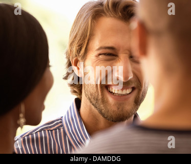 Friends talking outdoors Stock Photo