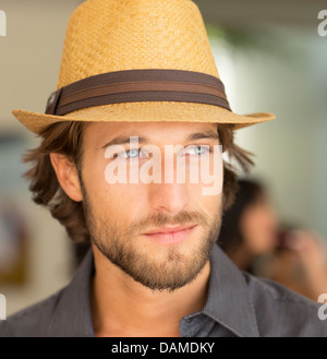 Smiling man wearing straw hat Stock Photo