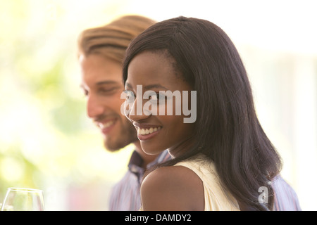 Smiling couple standing indoors Stock Photo