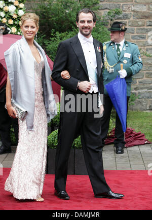 Prince Nikolaos of Greece and his wife Tatiana Blatnik leave after the religious wedding of Princess Nathalie of Sayn-Wittgenstein-Berleburg and  Alexander Johannsmann at the Evangelical Church of the castle in Bad Berleburg, Germany, 18 June 2011. The couple had a civil marriage on May 27th, 2010. Photo: Albert Nieboer Stock Photo