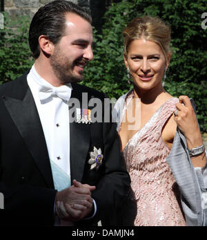 Prince Nikolaos of Greece and his wife Tatiana Blatnik arrive for the religious wedding of Princess Nathalie of Sayn-Wittgenstein-Berleburg and  Alexander Johannsmann at the Evangelical Church of the castle in Bad Berleburg, Germany, 18 June 2011. The couple had a civil marriage on May 27th, 2010. Photo: Albert Nieboer  NETHERLANDS OUT Stock Photo