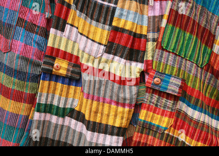 Colorful handmade checked pants for sale at the outdoor craft market in Cotacachi, Ecuador Stock Photo