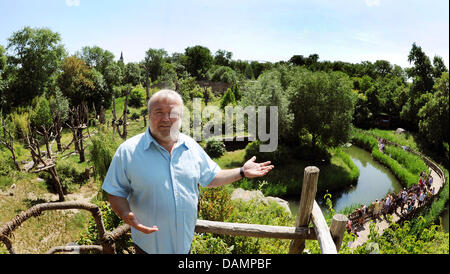 Zoo director Dr. Joerg Junhold stands in front of an outdoor enclosure for apes in the area of Pongoland inside the zoo in Leipzig, Germany, 3 June 2011. The Pongoland, existing for 10 years now, was built in a joint project with the Max-Planck-association and is used to investigate the behaviour of apes.  The zoo was founded in 1878. Within the project Zoo of future the zoo aims t Stock Photo