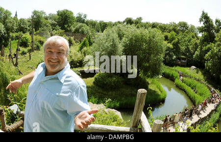 Zoo director Dr. Joerg Junhold stands in front of an outdoor enclosure for apes in the area of Pongoland inside the zoo in Leipzig, Germany, 3 June 2011. The Pongoland, existing for 10 years now, was built in a joint project with the Max-Planck-association and is used to investigate the behaviour of apes.  The zoo was founded in 1878. Within the project Zoo of future the zoo aims t Stock Photo