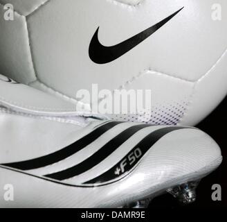 (dpa file) - A file picture dated 22 March 2007 of an adidas soccer shoe standing next to a Nike ball in Duesseldorf, Germany. In their race for the World's number one sports gear company, German contender adidas is competing at a high pace. Title defender Nike has problems keeping up. Photo: Achim Scheidemann Stock Photo