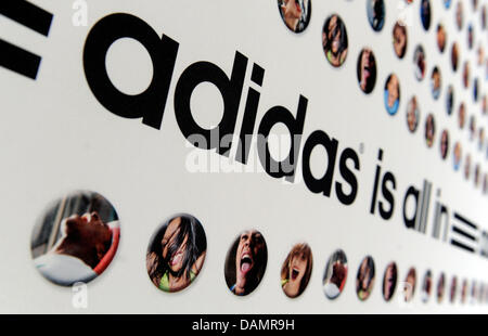 (dpa file) - A file picture dated 16 March 2011 of an advertisement banner saying 'adidas is all in' at the start of the same-named campaign in Munich, Germany. In their race for the World's number one sports gear company, German contender adidas is competing at a high pace. Title defender Nike has problems keeping up. Photo: Tobias Hase Stock Photo