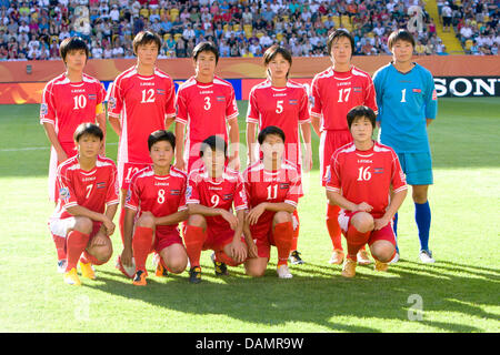 The starting line-up of North Korea (back L-R) Jo Yun Mi, Jon Myong Hwa, Ho Un Byol, Song Jong Sun, Fi Un Hyang, goal keeper Hong Myong Hui; (front L-R) Yun Hyon Hi, Kim Su Gyong, Ra Un Sim, Ri Ye Gyong, Jong Pok Sim; poses for a group photo prior to the Group C match USA against North Korea of FIFA Women's World Cup soccer tournament at the Rudolf Harbig Stadium in Dresden, German Stock Photo