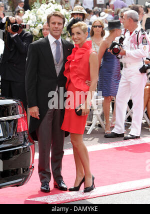 Prince Emanuele Filiberto of Venice and Piedmont and French actress Clotilde Courau, Princess of Venice and Piedmont, arrive for the religious wedding of Prince Albert II with Charlene Wittstock in the Prince's Palace in Monaco, 02 July 2011. Some 3500 guests are expected to follow the ceremony in the Main Courtyard of the Palace. Photo: Albert Nieboer Stock Photo