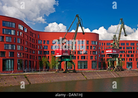 Landesarchiv NRW with two cranes in the inner harbour, Germany, North Rhine-Westphalia, Ruhr Area, Duisburg Stock Photo