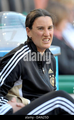 Player on the German national soccer team, Birgit Prinz, sits on the side bench during the practice session of the German women's national soccer team in Moenchengladbach, Germany, 04 July 2011. The FIFA Women's World Cup takes place in Germany from 26 June to 17 July 2011. Photo: Carmen Jaspersen Stock Photo