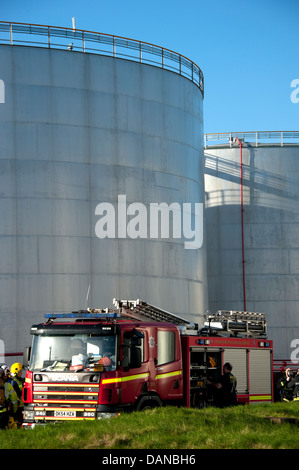 Fire Engines at Oil Refinery Storage Tanks Petrol Stock Photo