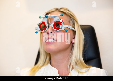 Customer at a optician trying test glasses in a trial frame for eyeglasses