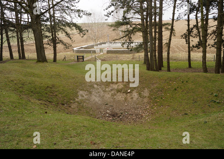 View towards, 'Railway Hollow' British Military Cemetery - in the foreground a shell hole or crater with many others in the area Stock Photo