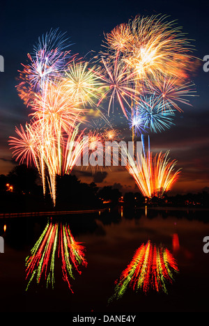 Firework streaks in the night sky. Spectacular pyrotechnic show by professional team Stock Photo