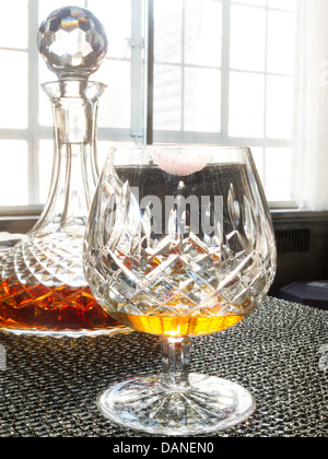 Crystal Decanter and Brandy Snifter Still Life Stock Photo